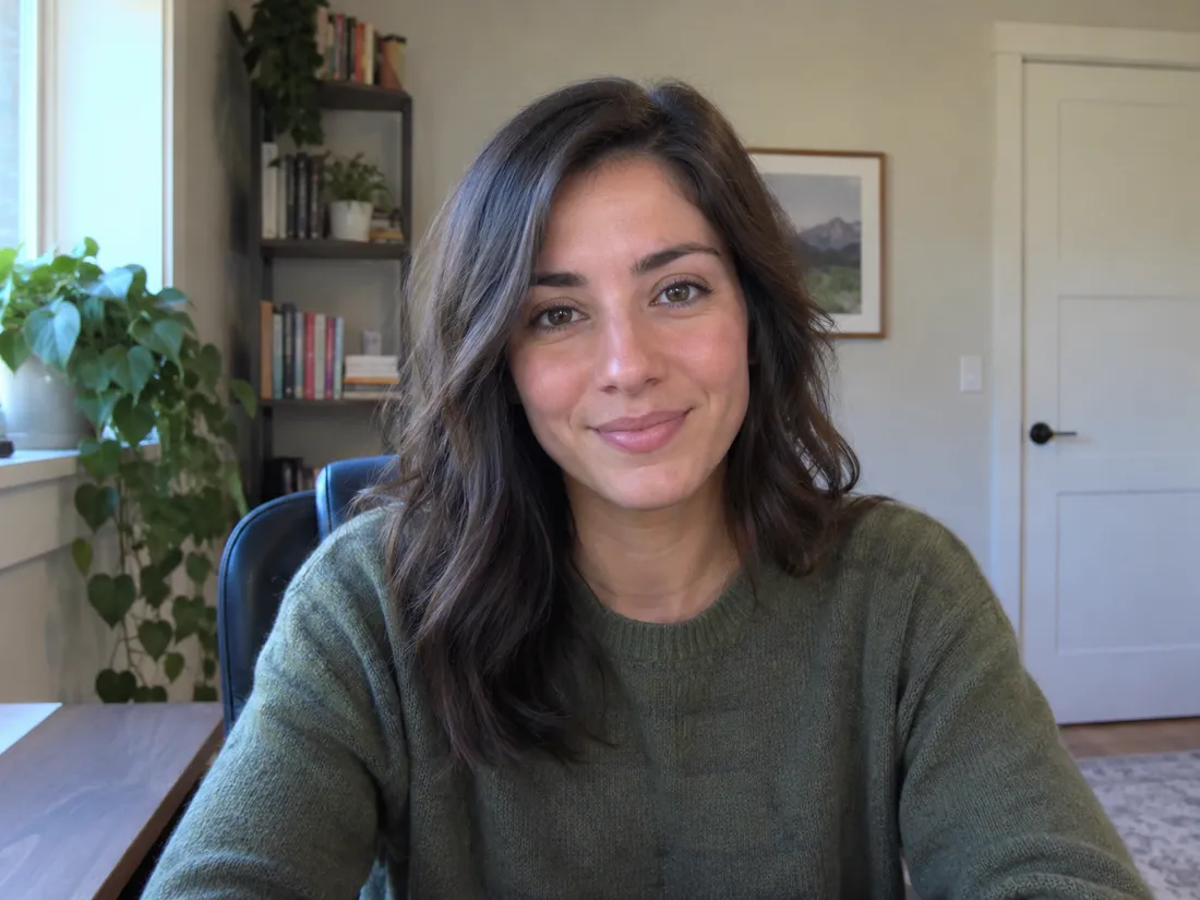 Sarah on the video call, smiling, in her home office